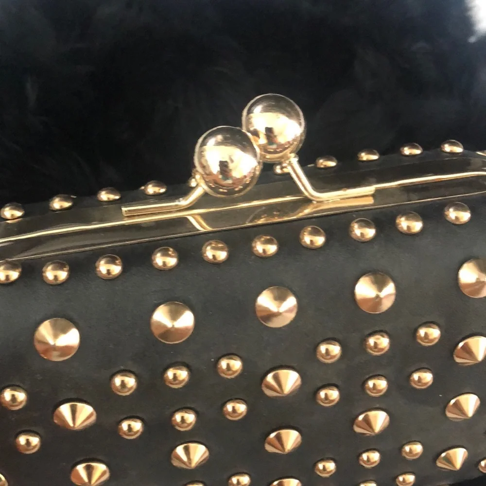 Black studded clutch